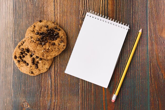 Tasty biscuits near notebook