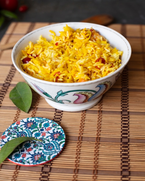 Tasty bowl of rice with tomatoes