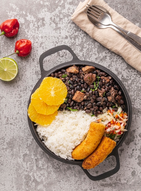 Free photo tasty brazilian dish with orange flat lay