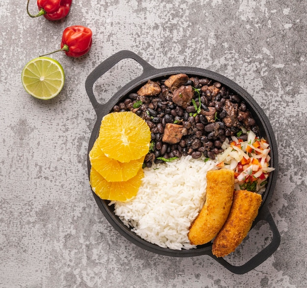 Free photo tasty brazilian dish with orange top view