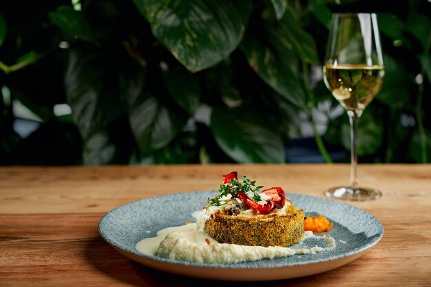 Tasty breaded fish with puree and grilled vegetables