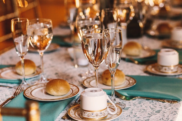 Tasty buns lie on white plates with golden design