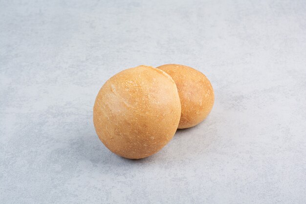 Tasty burger buns on marble background. High quality photo