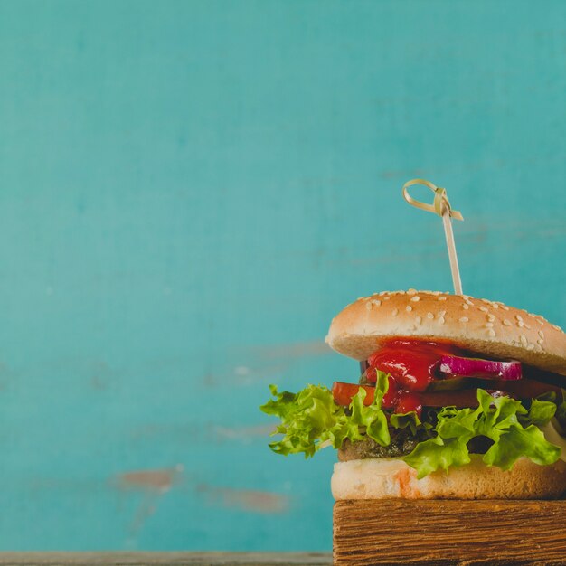 Tasty burger with fresh lettuce