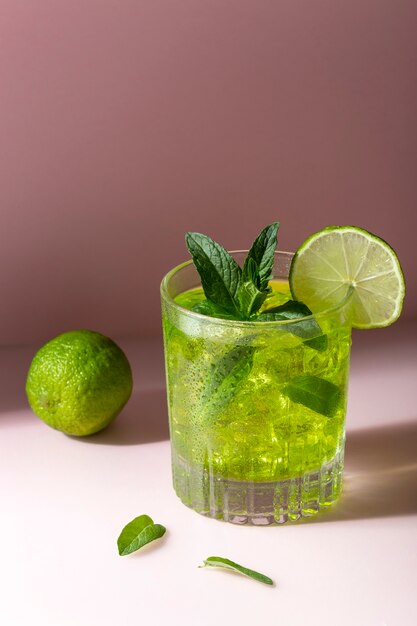 Tasty caipirinha with lime high angle