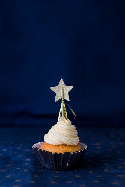 Tasty cake with butter cream and star 