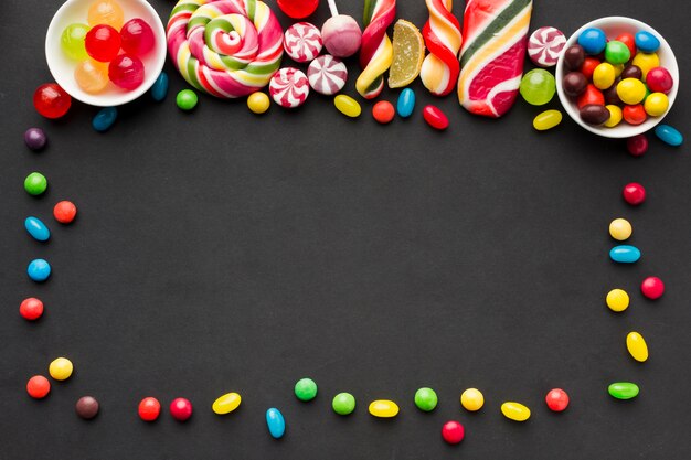 Tasty candies frame with copy space