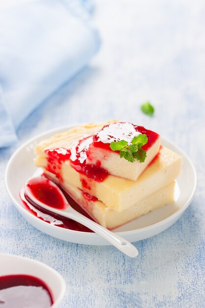 Tasty cheesecake with strawberry jam