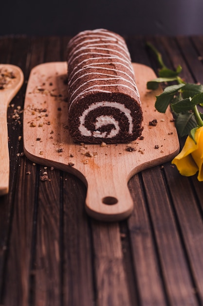 Tasty chocolate dessert on cutting board