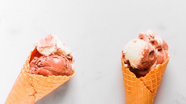 Tasty chocolate ice cream in waffle cone 