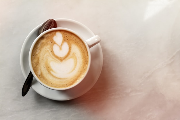 Tasty classic traditional italian coffee cappuccino on table in cafe. Day Light. Top View with Copy Space.