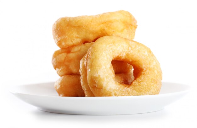 Tasty colorful donuts on the plate