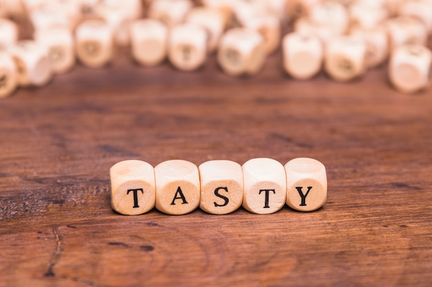 Free photo tasty concept made with wooden cubes