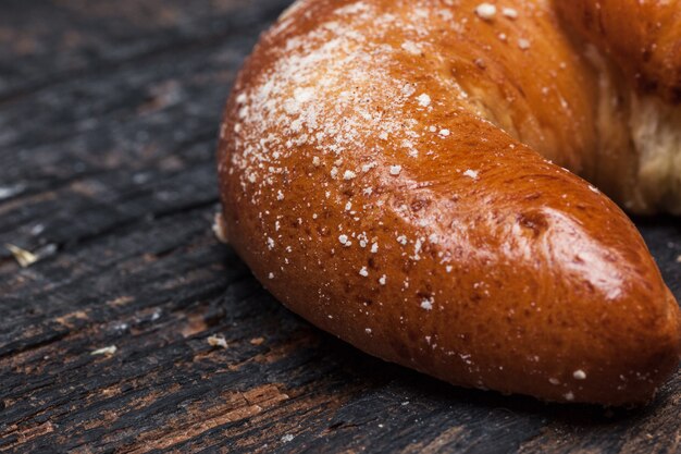 Tasty croissant on wooden