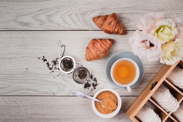 Tasty croissants on wooden background