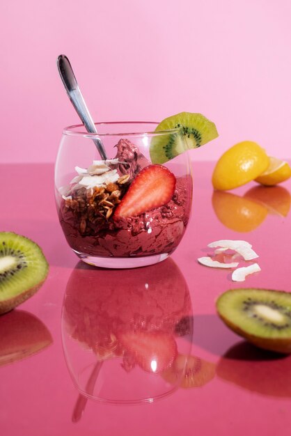 Tasty cup of açai dessert with kiwi
