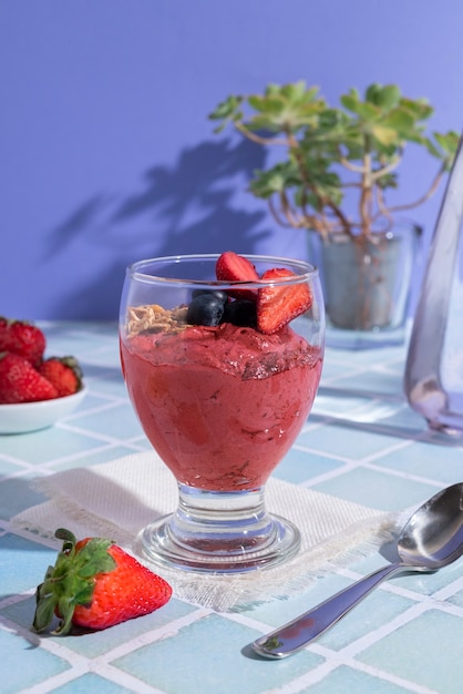 Tasty cup of açai dessert with  strawberries