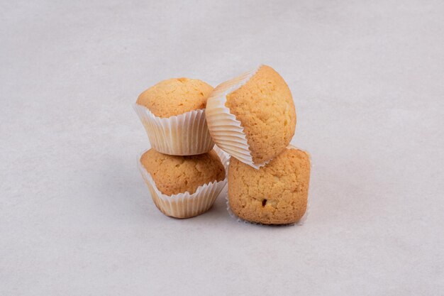 Tasty cupcakes on white table .