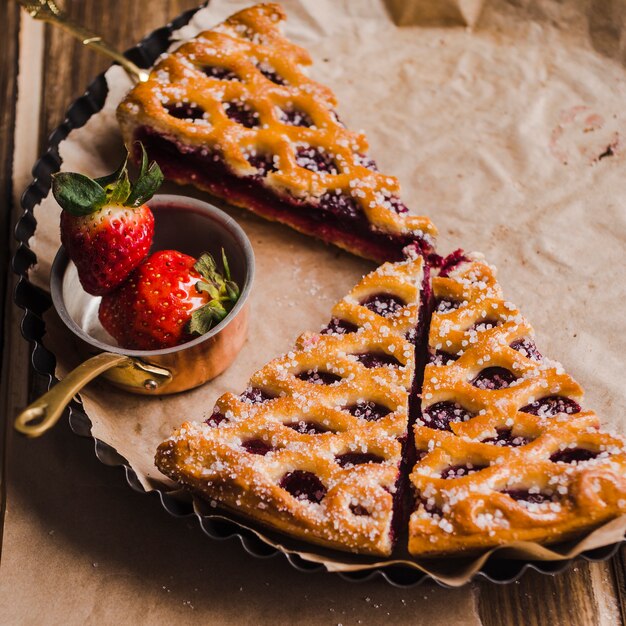 Tasty dessert serving on baking tin