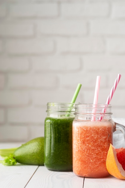 Tasty drinks with leaves and grapefruit