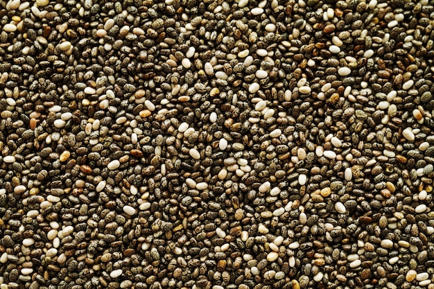 Tasty fresh chia seeds background. Top view. Superfood, healthy food concept.