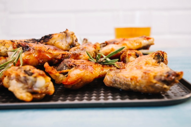 Tasty fried wings on tray