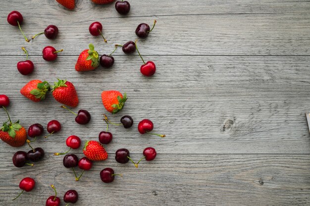 Tasty fruits on wooden surface