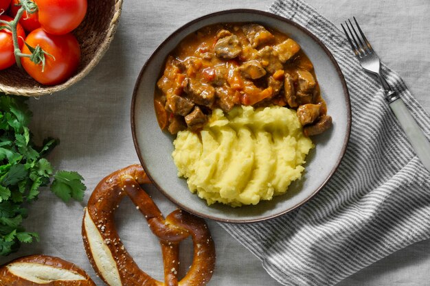 Tasty goulash and mashed potatoes top view