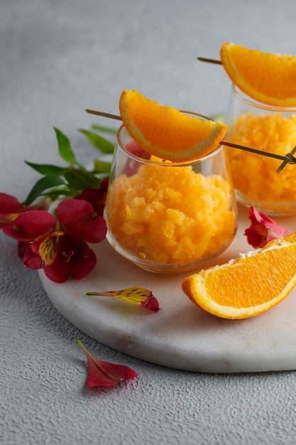 Tasty granita dessert with orange still life