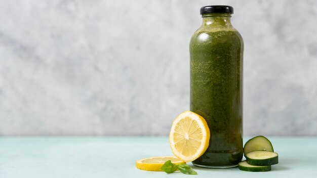 Tasty green drink with lemon and cucumbers