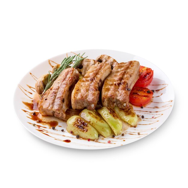 Tasty grilled ribs with vegetables on plate, isolated on white background. Photo for the menu