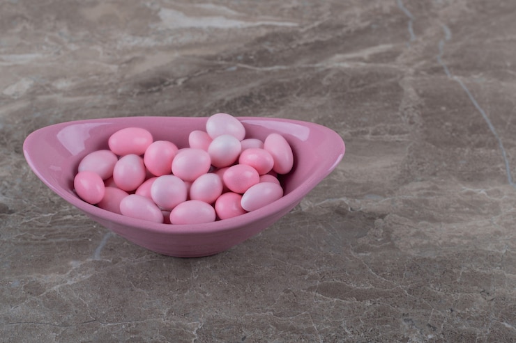 Free Photo tasty gumballs in the bowl on the marble surface