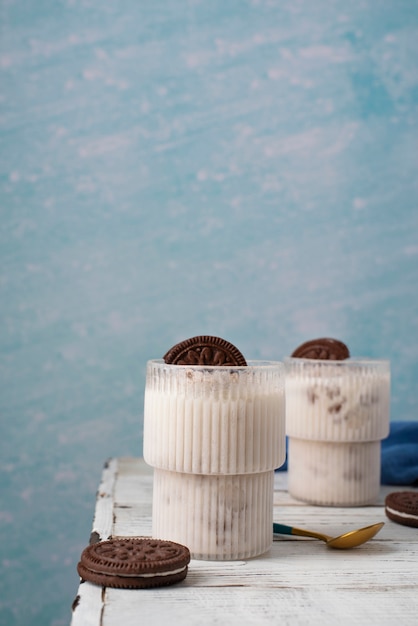 Tasty ice cream and cookies on table