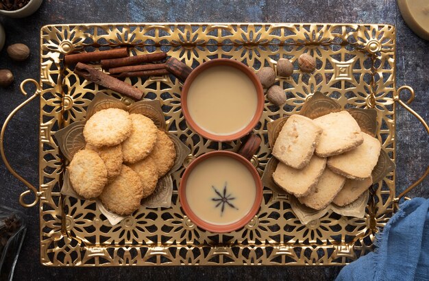 Tasty indian dessert and drinks arrangement