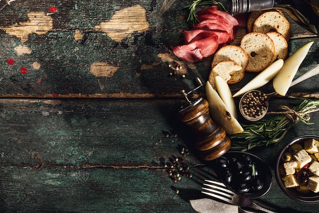 Tasty Italian Greek Mediterranean Food Ingredients Top View on Green Old Rustic Table Above 