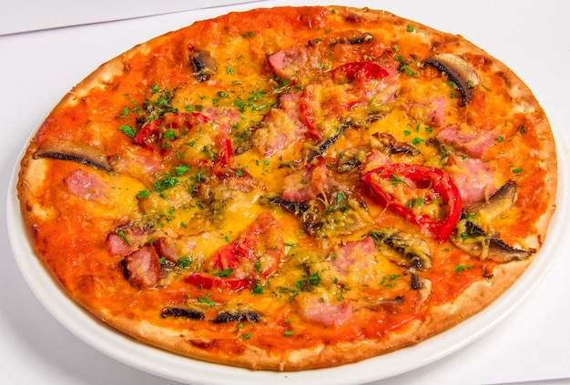 Tasty italian Pizza with bacon and tomatoes