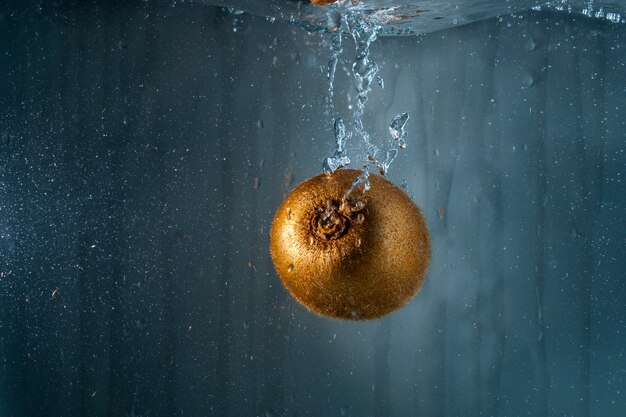 Tasty kiwi immersed in water