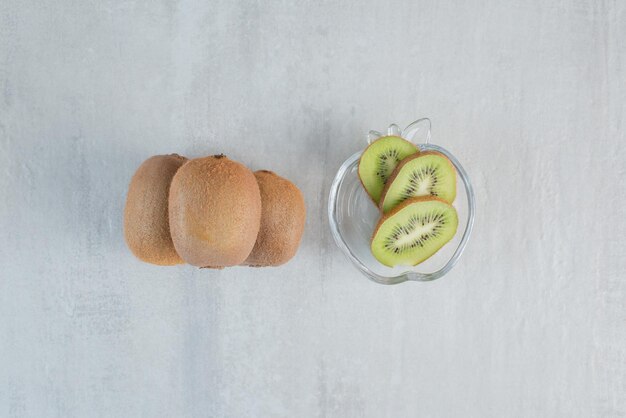 Tasty kiwi with slices on white