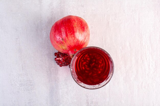 Tasty lemonade with pomegranate on white background. High quality photo