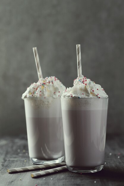 Tasty milkshake drink with straw