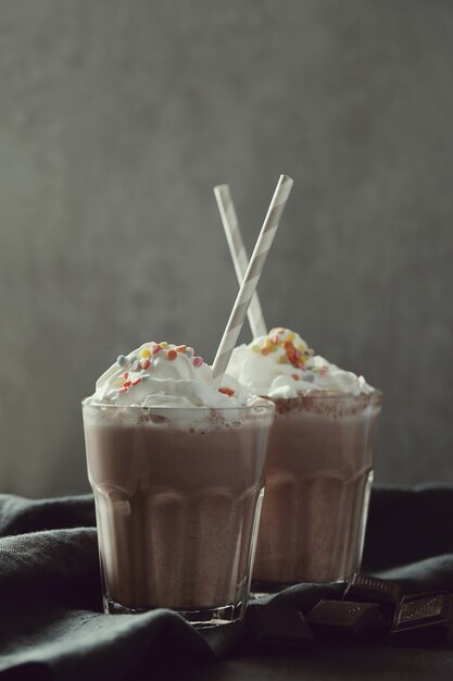 Tasty milkshake drink with straw