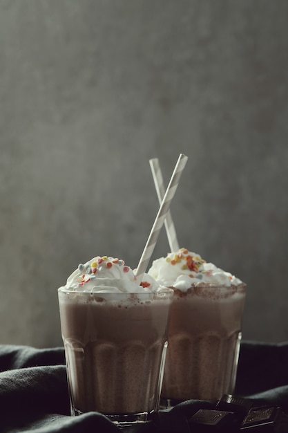 Tasty milkshake drink with straw