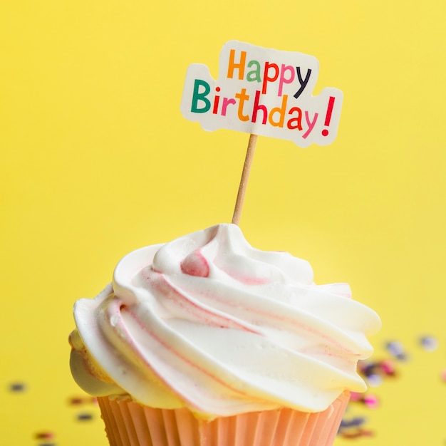 Tasty muffin with happy birthday sign