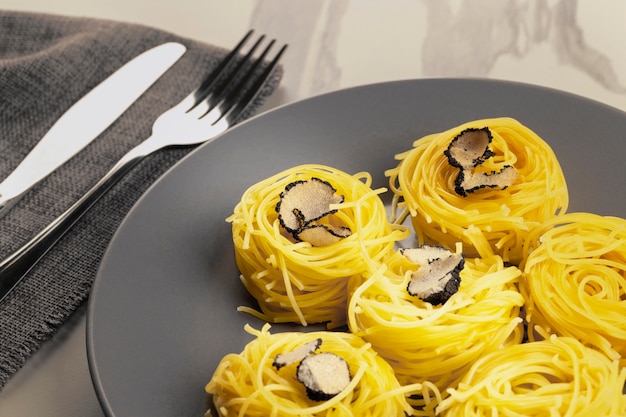 Free photo tasty pasta with truffle high angle