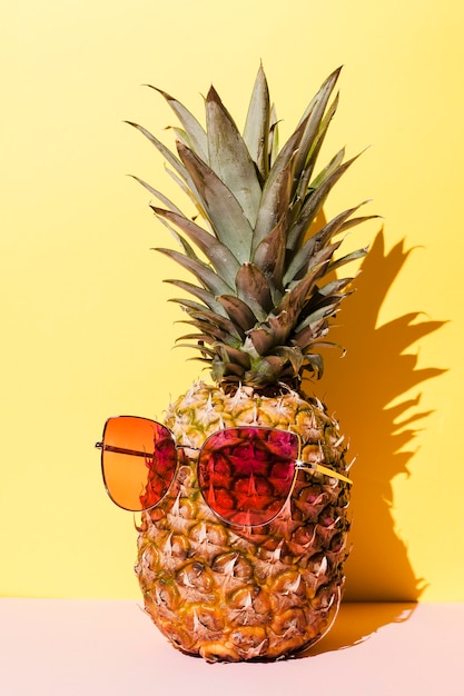 Free photo tasty pineapple with sunglasses