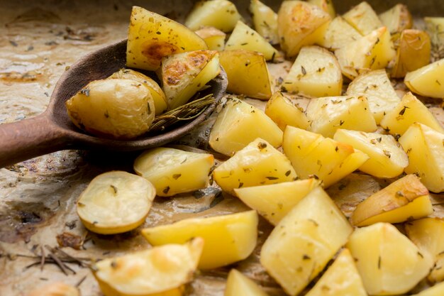 Tasty potatoes with wooden spoon