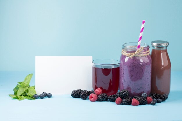 Tasty purple fruit and juices with copy space