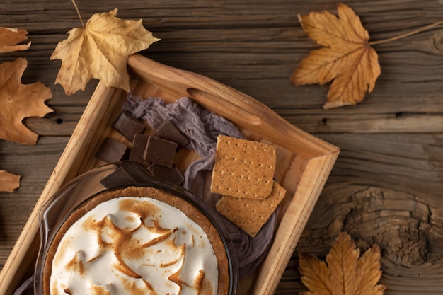 Tasty s'mores dessert on table