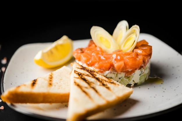 Tasty salmon meal close up