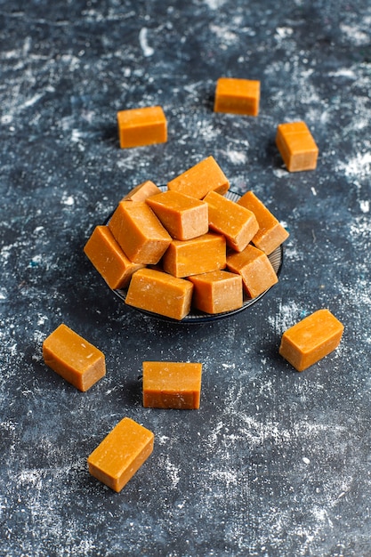 Tasty salty caramel fudge candies with sea salt, top view